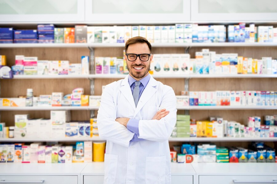 portrait smiling caucasian pharmacist standing drug store with arms crossed_308072 679